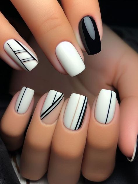 A minimalist black and white nail design with clean lines and geometric shapes, for a sleek and modern appearance Black Nails White Lines, Simple Geometric Nail Art, Black And White Line Art Nails, Grey Nails With Black Lines, Nails Line Design, Black Line Nail Art, Simple Black And White Nails, Black White Geometric Nails, White Spring Nails