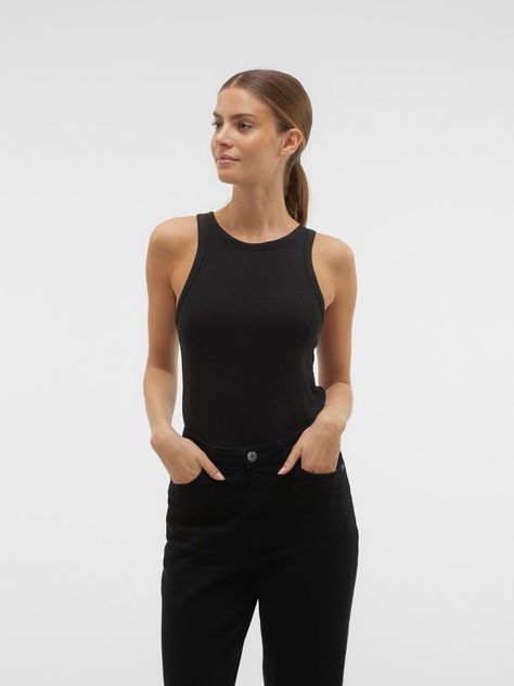 Basics are inevitable to find in almost every wardrobe out there. Our basic tops help bind an outfit together and this top makes no exception. Wear it with a shacket on top, a pair of relaxed mom-jeans, and chunky boots and you get a relaxed and cool everyday look.
AWARE by VERO MODA is our unique product line of better quality go-to pieces, designed with necessary preferred, certified, and branded fibres that reduce the amount of natural resources used during production.
 - Product Type : Tank top
 - Neck : Round Neck
 - Sleeve : Sleeveless
 - Fit : Tight Fit Black Sleeveless Top Outfit, Sleeveless Top Outfit, Bath And Body Shop, Poncho Cardigan, Black Sleeveless Top, French Hair, Top Outfit, Costume Intero, Jeans Mom