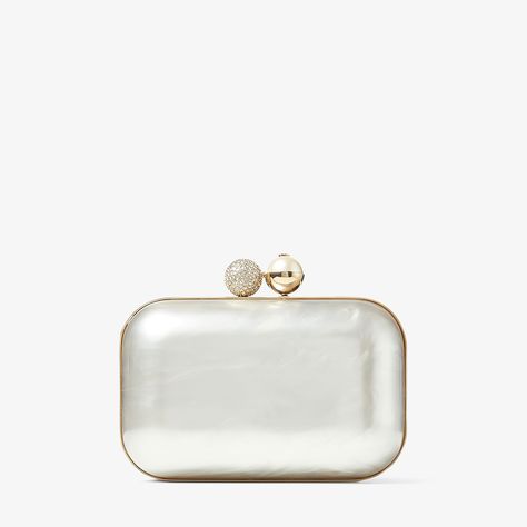 Our Cloud clutch is a glamorous piece in ivory Mother of Pearl. Cleverly crafted to fit naturally in your hand, this compact minaudiere is exquisitely structured with a detachable chain strap and features a spacious interior for all of your day or night essentials. A timeless piece, complemented with a ball clasp decorated with pearls and crystals. Collage Bag, Minaudiere Bag, Jimmy Choo Bags Clutches, Money Party, Ivory Clutch, Pearl Clutch Bag, Prom Clutch, Jimmy Choo Clutch, Color Marfil