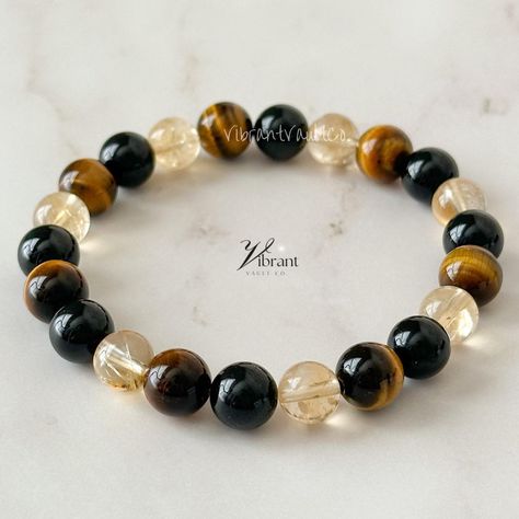 "⭐ PLEASE SEE THE BRACELET SIZE GUIDE BEFORE ORDERING ⭐ Tiger's Eye, Citrine, & Black Tourmaline Bracelet | \"Inner Confidence\" Bracelet for protection, grounding, and confidence  Tiger's Eye helps you feel confident and courageous while helping you be more grounded. It is often used as a stone of protection, so it can help you to feel safe when you are healing from trauma or change.  Citrine will help you to manifest your desires and attract abundance. Citrine is said to bring happiness and joy into your life, so it will help you find happiness within yourself.  Black Tourmaline is a powerful stone that protects against negative energy by absorbing it. This helps you stay balanced no matter what comes into your life. Bracelet Info:  8mm-8.9mm Natural Tiger's Eye Round Beads  8mm-8.9mm Na Stretch Beaded Bracelets Diy, Black Tourmaline Bracelet, Energy Spiritual, Inner Confidence, Eye Round, Bracelets Handmade Diy, Attract Abundance, Cord Jewelry, Find Happiness