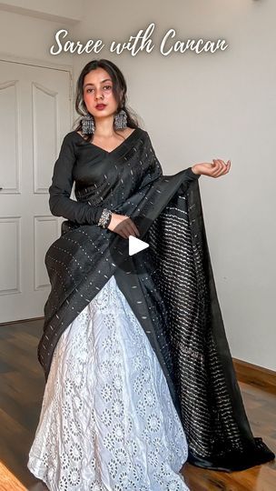 681K views · 118K reactions | Save and send this Saree on Lehenga tutorial to a saree lover 🖤

Draped a pure silk saree in mulberry with tanchoi weave on deep black body topped with sterling silver zari woven 1000 butas and a classy double border.

Created a unique saree draped or unique saree styling tutorial for saree beginners. Paired it with a cancan and a long flared skirt. Added oxidised jewellery to complete the look.

How to wear a saree on cancan-
🖤 Pick lightweight pure silk sarees fabric like Katan silk, mulberry silk, tussar silk, khaddi chiffon, khaddi georgette, gajji silk and assam silk.
🖤 Layer up your cancan as much as you want but make sure it’s easy to walk in.
🖤 You can drape the saree in half saree pattern or as a regular saree depending upon the fabric length.
🖤 Cancan Lehenga Skirts, Can Can Saree Drape, Saree On Lehenga, Unique Saree, Saree Pattern, Saree Styling, Long Flared Skirt, Saree Draping Styles, Saree Draping