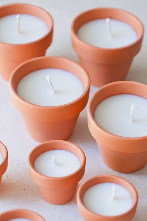 diy terracotta votive candles    Add a beautiful glow to an outdoor area with these charming DIY terracotta votives! They make beautiful gifts too! and you can decorate the pot to personalize the gift  Tip from Daw I add 1 or 2 drops of essential oil of your choice to scent the wax or you can buy the scented wax from craft stores Joululahjat Diy, Creation Bougie, Soya Mumu, Terra Cotta Pot Crafts, Shelves Diy, Hemma Diy, Clay Pot Crafts, Candle Craft, Mini Candles