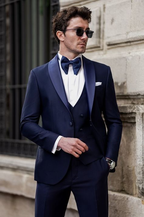 Elevate your style game with our Navy Slim-Fit Tuxedo 3-Piece, designed to make a lasting impression at high-profile events and exclusive soirées. Tailored from luxurious navy fabric, this ensemble features a slim-fit jacket with sleek satin lapels, exuding timeless elegance and sophistication.   #singlebreasted #suit #suits #slimfit #menstyle #menfashion #fashioninspo #formalwear #menclothing #formalattire #tuxedo #navytuxedo Grooms Suits, Suit For Men Wedding, Mens Wedding Suits, Navy Tuxedos, Blue Tuxedo, Dapper Suits, Suit Stores, Slim Fit Suit Men, Wedding Tuxedo