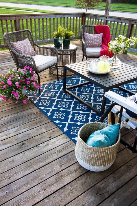 Ready for summer entertaining? Check out these simple deck decorating ideas and tips for sprucing up your patio, porch, and deck for summer. #deckdecor #outdoordecor Simple Spring Porch Decor, Simple Deck Decorating Ideas, Decorating A Deck Ideas, Back Deck Ideas Porch Decorating, Decorating Deck Ideas, Decorating A Deck, Deck Ideas Decorating, Summer Deck Decor, Deck Decor Ideas