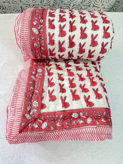 This is Indian Famous Hand Block Printed Quilt, Jaipuri Rajai. Beautiful Hand Block Print Reversible Winter Razai Quilt In Side Doctor Cotton Item - Razai Quilt Blanket Pattern - Rabbit Print Colors - Pink Twin Size - (60 X 90 Inches) (150 X 225 CM ) Queen Size (90 X 108 inches) ( 225 X 270 CM ) King Size (108 X 108 inches) ( 270 X 270 CM ) Wash Instruction - Dry Clean Only Used as: -Quilt, Bed spread, Blanket, Bed cover, Sofa cover NOTE: The color of images shown above may slightly vary due to Beautiful Rabbit, Block Print Quilt, Hand Stitch, Warm Blanket, Rabbit Print, Sleepy Hollow, Printed Quilt, Oui Oui, Warm Blankets