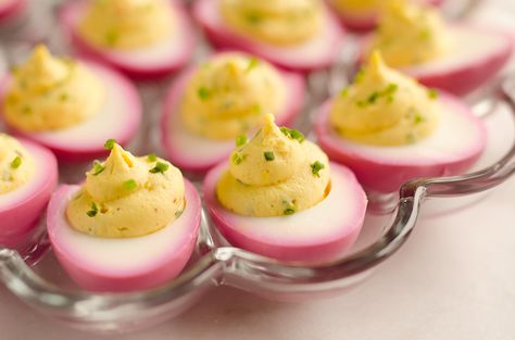 Pink Pickled Deviled Eggs are a beautiful side dish or appetizer perfect for your holiday table. Hard boiled eggs are lightly pickled in beet juice and vinegar for the unique color that is sure to impress your guests! Pickled Deviled Eggs Recipe, Cranberry Almond Energy Bites, Pickled Deviled Eggs, Egg Cups Recipe, Best Deviled Eggs, Pickled Eggs, Deviled Eggs Recipe, Beet Juice, Eggs Recipe