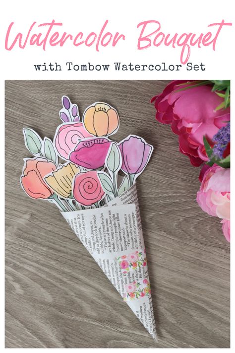 Image contains a watercolor flower bouquet on a wooden table with silk flowers off to the side. Flower Art Bouquet, Diy Craft Bouquet, Paper Flower Bouquet Card, Bouquet Of Flowers Card, Diy Flower Bouquet Party, Painted Bouquet Of Flowers, Flower Arts And Crafts For Kids, Diy Spring Crafts For Kids, Easy Creative Projects