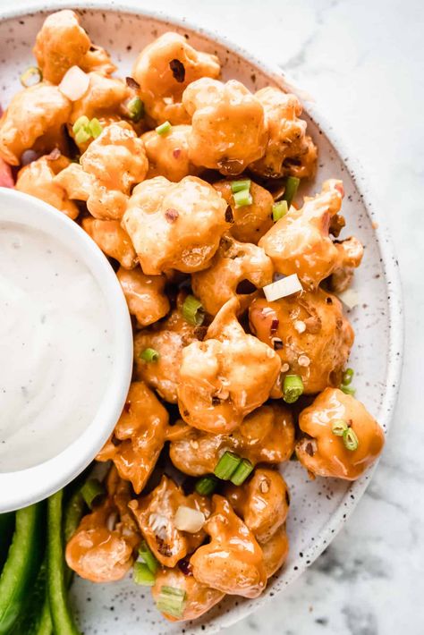 Why do you need to make this air fryer bang bang cauliflower? It's a tasty appetizer with a kick that is so easy to make! The bang bang sauce is made with Greek yogurt and honey, so it's a must have for guilt-free snacking! You’ll feel great serving this to your family because they are getting a healthy dose of nutritious cauliflower in every bite! Cauliflower Wings Air Fryer Recipes, Kung Pao Cauliflower Air Fryer, Bang Bang Cauliflower Air Fryer, Cauliflower Hot Wings Air Fryer, Vegan Cauliflower Wings Air Fryer, Bang Bang Cauliflower, Healthy Superbowl, Steamed Cauliflower, Healthy Superbowl Snacks