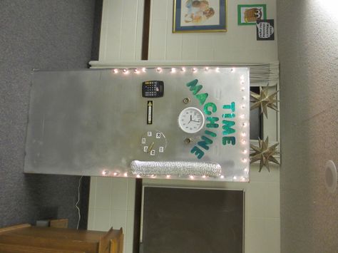 I made this time machine for church.  I got a refrigerator box from Lowe's (they were great) and it took about 5 cans of silver metallic spray paint.  Search your garage for knobs and parts. The side has a door with a handle that says "pull". I used a Christmas light remote control to turn the lights on to surprise the kids.  It's alot of fun, use your creativity!  The kids loved it! This week we went back 5,000 years . . . Noah had just gotten off the ark :D Time Machine Door Decoration, Christmas Light Controller, Kids Church Rooms, Primary Chorister, Diy Christmas Lights, Primary Ideas, Metallic Spray Paint, Primary Activities, Arts Integration