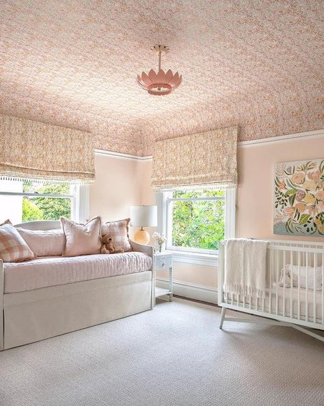 Pink Nursery with Pink Wallpapered Ceiling - Transitional - Nursery Ceiling Wallpaper Nursery, Light Pink Bedding, Pink Room Design, Wallpapered Ceiling, Transitional Nursery, Blue Bookshelves, Pink Accent Walls, White Sheepskin Rug, Blue Nursery Boy