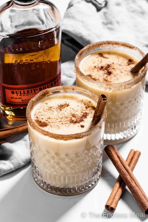 If you longed to dip into the holiday punch bowl that held the spiked eggnog, now's your chance to indulge in this sweet, warm, delicious bourbon eggnog. It's creamy and cozy and perfect for a cold winter's evening. #theendlessmeal #bourboneggnog #boozyeggnog #bourbon #eggnog #christmas #holiday #festive #cocktail #drink Christmas Cocktails Eggnog, Holiday Eggnog Cocktails, Christmas Eggnog Cocktails, Egg Nog Cocktail Recipe, Christmas Cocktail Aesthetic, Warm Christmas Cocktails, Christmas Dinner Drinks, Christmas Mixed Drinks, Hot Holiday Drinks