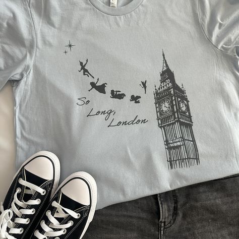 One of our favorite shirts! This oversized loose fit tee is perfect for a day around town or better yet at a theme park! With a touch of pixie dust and a whole lot of Swiftie attitude what could go wrong! #disney #disneyworld #disneyland #peterpan #pixiedust #tswift #taylorswift Disney Park, Fairy Dust, Mom Boss, Pixie Dust, Disney Shirts, Disney Inspired, Shopping Trip, Favorite Shirts, Peter Pan