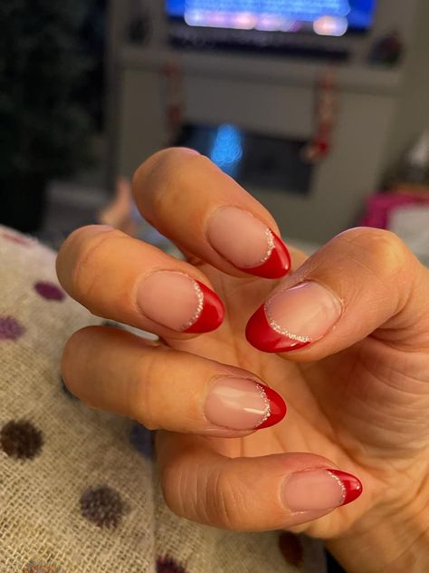 Short Almond French Tip Nails Christmas, Easy Christmas French Tip Nails, Hoco Nails For A Red Dress, Short Tip Christmas Nails, Red French Tip With Glitter Line, Christmas Nails Simple Design, Red French Tip With Silver Line, Red And White Tips Nails, White And Red Nails French Tip