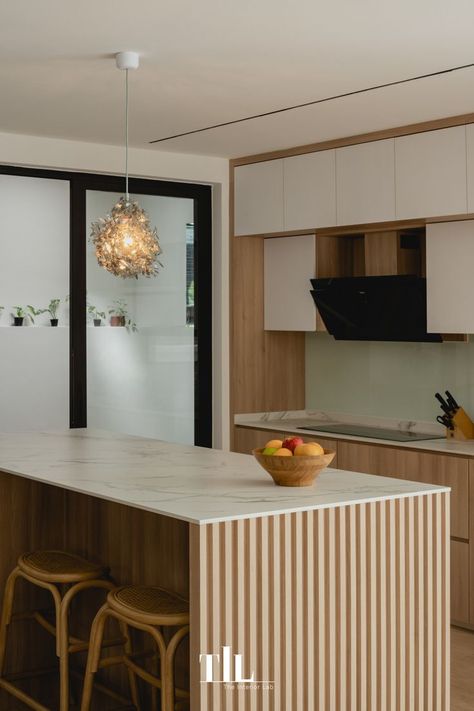 Wooden fluted panels of the kitchen island highlights refined detailing against the white and neutral cabinetry, presenting a clean and timeless appearance. #ApartmentTherapy #ArchitecturalDigest #Dwell #InteriorDesign #InteriorInspo #HomeDecor #HomeInspo #Kitchen #KitchenInspo #Houzz #TheInteriorLab Kitchen Island Panels, Clean Kitchen Design, Connected To Nature, Japandi Interior Design, Japandi Interior, Neutral Colours, Kitchen Photos, Commercial Interior Design, Wooden Kitchen