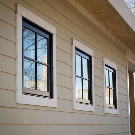 White Trim Tan House Black Windows Exterior, Tan House With Black Windows, Tan House Black Windows, Tan Farmhouse Exterior, Tan House Black Trim, Black Windows Exterior Color Schemes, House Trim Exterior, Outdoor Window Trim, Cream Colored Houses