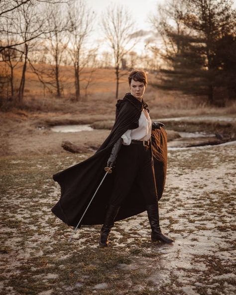 Duo With Swords Pose, Cloak Blowing In The Wind, Person Wearing Cloak, Flowing Cape Drawing Reference, Cape Pose Reference, Cloak Poses, Cloak Photoshoot, Medieval Traveler, Cloak Aesthetic