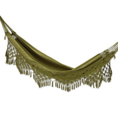 After a long day full of stress, nothing is better than comfortably resting on a soft surface in the open air, listening to the peaceful chant of the birds. The Hammock Artisans of Ceara, from Brazil, make this ethereal scenario possible by creating a single hammock with cotton in a charming olive tone and adding crocheted accents at each side, all made in a traditional loom called mamucaba Hamicks In Bedrooms, Hammock Green, Indoor Hammock Bed, Hammock In Bedroom, Fairy Room, Rope Hammock, Olive Tone, Indoor Hammock, Camping Hammock