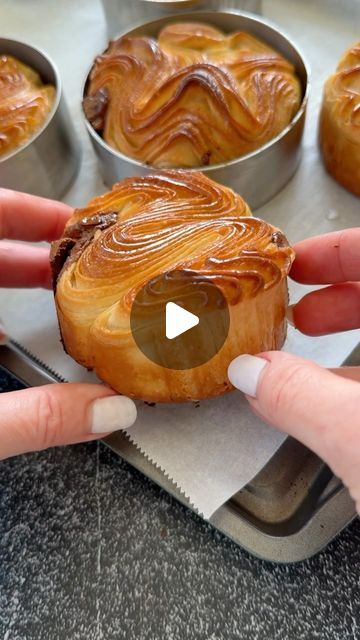 Natalya Syanova on Instagram: "Laminated buns, like those found in French bakeries, can be made at home 😉  Use the croissant dough recipe from my website. Do 1 double and 1 single fold, then roll the dough to 8 mm thick square with sides measuring 20x20 cm. Cut it into 1-inch strips, fold, place, and proof inside an 8 cm baking ring. Bake as usual.   Find the detailed recipe on my website; the link is in my bio ⬆️⬆️⬆️  FOLLOW @natashas_baking for more creative ideas.  #croissant #lamination #viennoiseries #frenchbreakfast #frenchfood #chicagofood #yummy #foodie #explorepage #creator #bakewithme #homebaker #bakerslife #bakersfield" Laminated Dough Pastries, Home Made Croissants, Croissant Dough Ideas, At Home Bakery Ideas, Bakery Breakfast Ideas, Square Croissant, Natashas Baking, Croissant Dough Recipe, Round Croissant