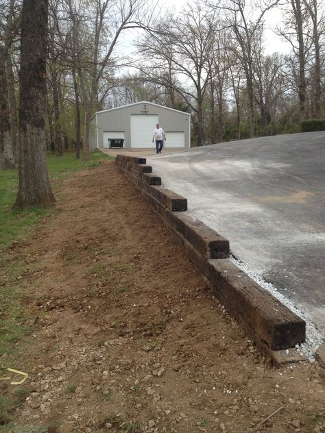 Railroad tie wall. Old school! Railroad Tie Projects, Railroad Tie Edging, Railroad Ties Edging, Landscaping Railroad Ties, Railroad Ties Driveway, Railroad Ties Landscaping Driveways, Rail Ties Landscaping, Railroad Ties Driveway Edging, Railroad Ties Border