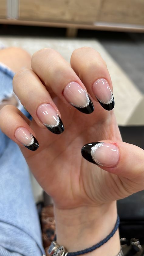 Black Nails Ideas Sparkle, Nails That Go Good With Black Dress, Nails To Get With A Black Dress, Black Glitter Nails Almond Shape, Black French Tips With Silver Line, Black French Tip Nails Sparkle, Nail Ideas Black And Silver, Black French Tip Nails Round, Black And Silver Almond Nails