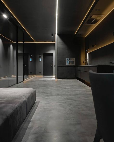 This apartment has a dark color scheme with some reflective panels and lighting. The look is really outstanding in its simplicity. There are some yellow lamps installed there to calm down the solid dark atmosphere around the room. Hi-Tech Design from @allofarchitecture Yellow Lamps, Dark Interior Design, Dark Atmosphere, Interior Studio, Yellow Lamp, Dark Modern, Apartment Decoration, Trend 2024, Dark Interiors