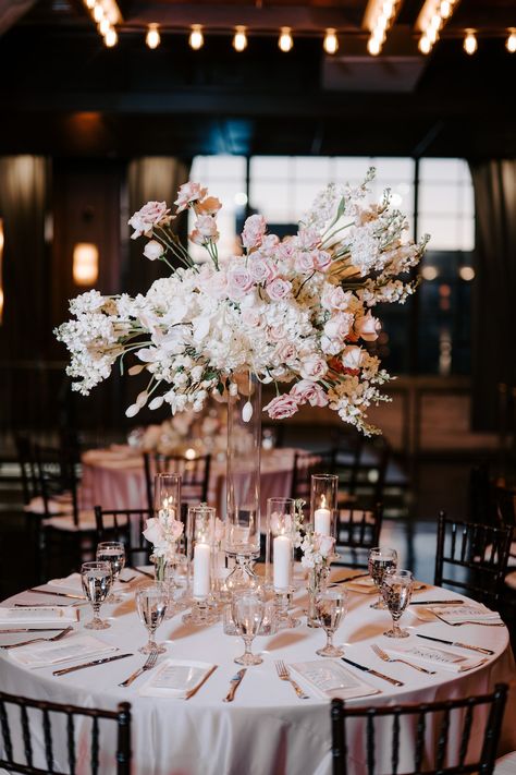 A round reception table with a tall floral arrangement of white and blush florals. Black White Blush Wedding, Blush Pink And Black Wedding, Modern Pink Wedding, White And Blush Wedding, Black Wedding Table, Baby Pink Wedding, Family Style Table, Romantic Ceremony, Pink Wedding Decorations