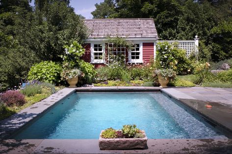 Surrounded by abundant perennials such as Shasta daisies, as well as terra cotta pots planted with vibrant annuals, the rose-covered pool house enhances the cottage feel. Cottage With Swimming Pool, Pool House Cottage, Cottage Backyard With Pool, Cottage Swimming Pool, Cottage Pool Backyards, Cottage Pool House, Cottage With Pool, Cottage Pool, Secluded Cottage