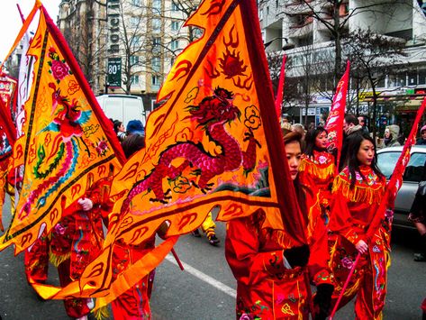 Marchers carrying flags in Paris Chinese New Year Parade Chinese New Year Makeup, New Year Makeup, Chinese New Year Parade, Chinese New Year 2022, New Years Dinner, New Year's Makeup, New Years Activities, Dragon Dance, Lion Dance