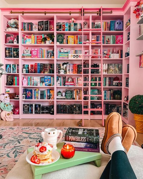 This pretty in pink library has had a hauntingly cute makeover 👻🎀 @theintrovertedition's home library is the stuff of dreams at the best of times, but the halloween decor has made it extra cozy. #halloweendecor #homelibrary #pinkdecor #librarygoals #myrealhome Pink Built In Bookcase, Billy Bookcase Aesthetic, Pink Home Library, Pink Library Room, At Home Library Aesthetic, Pink Bookshelf Aesthetic, Small Book Room, Book Nook In Bedroom, Pink Library Aesthetic