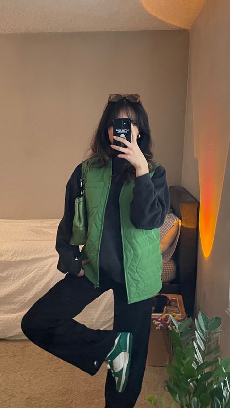 outfit idea with green stussy vest baggy black pants nike dunks sunglasses Minimal Outfits For Women Winter, Womens Stussy Outfit, Nike Dunks Fall Outfit, Black Women Dunks Outfit, Sporty Baggy Outfit, Stussy Vest Outfit, Black Pants Street Style, Green Vest Outfit Aesthetic, Baggu Outfits Ideas