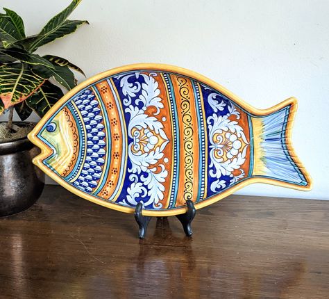 "Deruta Fish Platter Sberna Deruta Made In Italy Hand Painted Italian Ceramics Kitchen Gift Wonderful large fish platter. This colorful Italian ceramic serving platter is hand hand painted and made in Deruta, Italy in the style typical of the region. I imagine when not in use, this will make a beautiful display piece. The size is 18\" long, 9.5 inches wide. The lip rim is up to 1.5\". Good condition, no issues. Please message me with any questions. Visit Fernvale Vintage for other beautiful find Deruta Italian Ceramics, Ceramics Kitchen, Deruta Pottery, Hand Painted Kitchen, Ceramic Serving Platter, Pottery Fish, French Lamp, Fish Platter, Lamp Finial