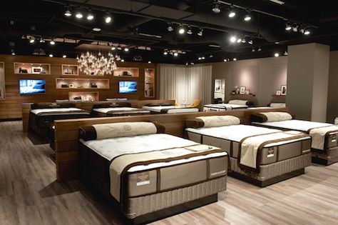 Stearns & Foster showroom Mattress Store Design, Bedroom Showroom, Stearns And Foster Mattress, Furniture Store Design, Showroom Decor, Partition Walls, Furniture Dolly, Spring Bedroom, Furniture Ads