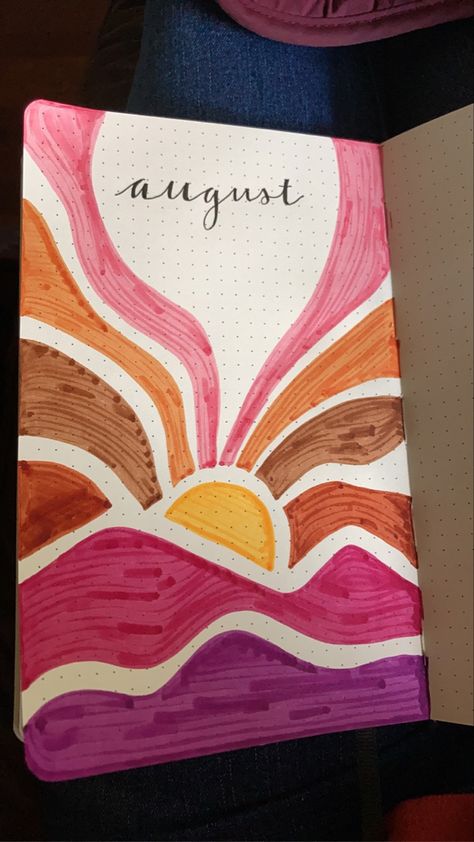 August Bullet Journal cover page. Title is “august” and is surrounded by a drawing of an alternative style of sunset over mountains. Mountains are pink and purple with the sun rays differing shades of brown. August Journal Ideas Aesthetic, Notebook Cover Painting Ideas Easy, Cute Journal Cover Design, Art Book Cover Ideas Drawing School, August Bullet Journal Cover Easy, Easy Aesthetic Drawings With Color, Pretty Journal Covers, Sunset Bullet Journal, Journal Ideas August