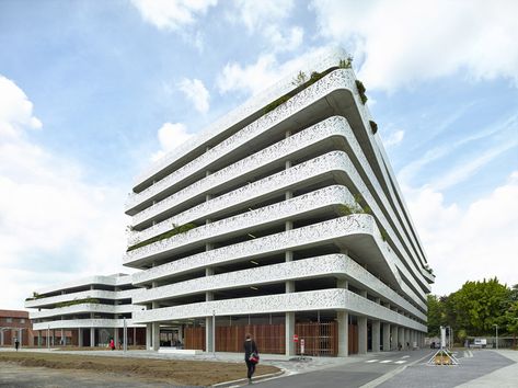 Perforations pattern facade of car park by Abscis Architecten Car Park Design, Hospital Signage, Parking Lot Architecture, Parking Building, Parking Solutions, Ghent Belgium, Wayfinding System, Mall Design, Ring Road