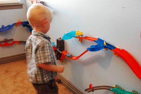 Hot Wheels Wall Tracks Review Hot Wheels Track Organization, Hot Wheel Race Track Storage, How To Store Hot Wheels Tracks, Hot Wheels Track Storage, Monster Truck Themed Bedroom, Hot Wheels Track Diy, Matchbox Storage, Monster Truck Bedroom, Hot Wheels Tracks