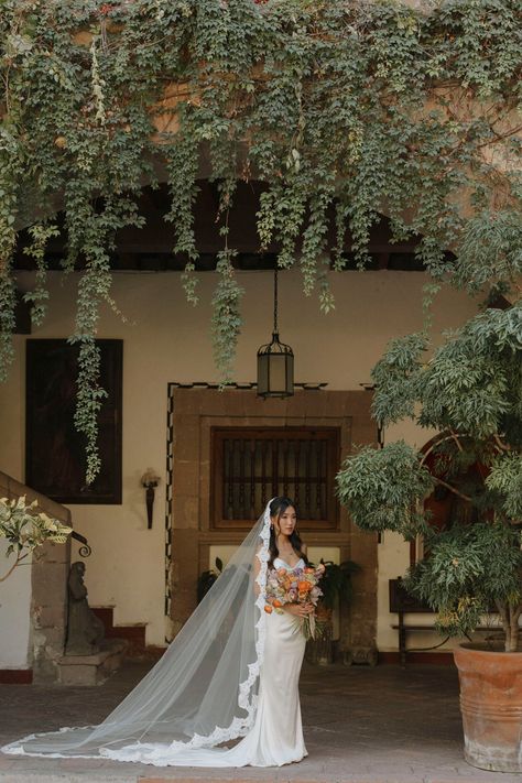 Add a touch of romance and Spanish glamour to your bridal attire with this luxurious mantilla cathedral veil. Combining a royal extra-long train with eyelash French lace edging, this veil will enchant both you and your guests with its billowing tulle and romantic lace. * Cathedral length veil or in a custom length  * Hand sewn from the most luxurious bridal illusion tulle * Mantilla style * 108'' width * In white, off-white, light ivory, ivory, or blush  * Add on silver and clear Czech beading or rhinestones to the lace for an extra charge (select "beaded lace trim" finish option upon check-out)  * The veil is attached to either a clear plastic hair comb or a metal hair comb (silver metal, gold metal, rose gold metal, or black metal) measuring 3'' in length for easy and secure placement in Cathedral Length Mantilla Veil, Spanish Style Veil, Mantilla Veil Wedding Spanish Style, Catholic Wedding Veil, Long Veil Wedding Hair, Cathedral Mantilla Veil, Charro Wedding Ideas, Spanish Veil, Long Wedding Veils