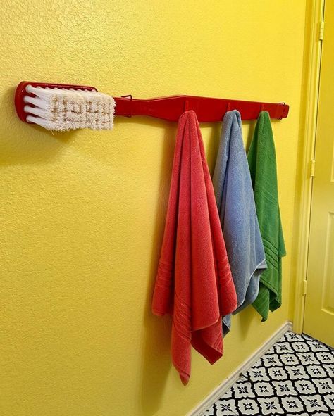 Giant Toothbrush Diy, Giant Decorations Diy, Funky Guest Bathroom, Fun Guest Room Ideas, Funky Maximalist Decor, Creative Towel Rack Ideas, Kaarin Joy, Giant Toothbrush, Colorful Small Bathroom