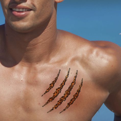 leopard print scratches tattoo on chest Scratches Tattoo, Chest Tattoo Bear, Tattoo In Chest, Tiger Claw Tattoo, Thoughtful Tattoos, Skin Tear Tattoo, Scratch Tattoo, Cheetah Print Tattoos, Leopard Print Tattoos