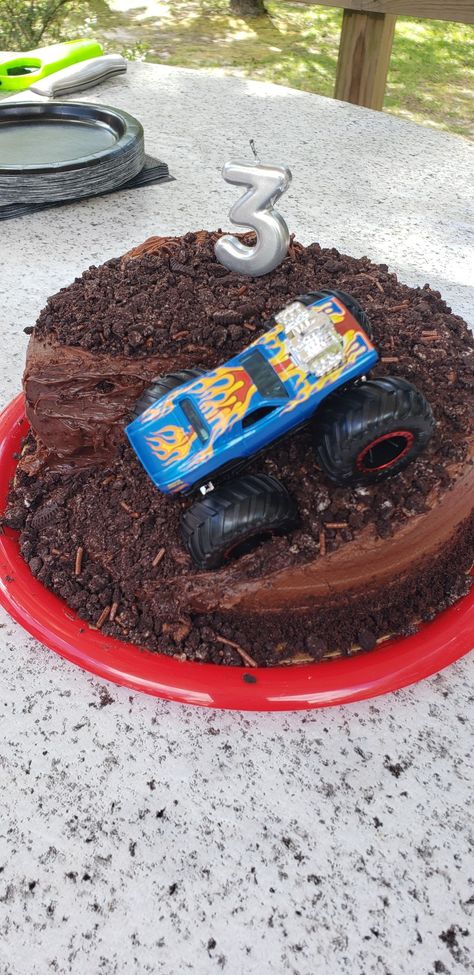 A simple chocolate cake with a chunk cut out, add some extra frosting and crushed oreos and you have a monster truck cake! Simple Chocolate Cake, Truck Cake, Truck Cakes, Easy Chocolate Cake, Crushed Oreos, Monster Truck, Chocolate Cake, Oreo, Frosting