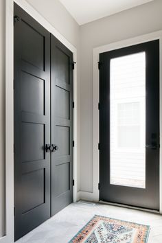 Large Entry Way Closet Ideas, Mudroom Closet Doors, Entrance Closet Doors, Foyer Closet Ideas, Mudroom Closet With Doors, Coat Closet Door Ideas, Modern Black Interior Doors, Mudroom Closets, Entrance Closet Ideas