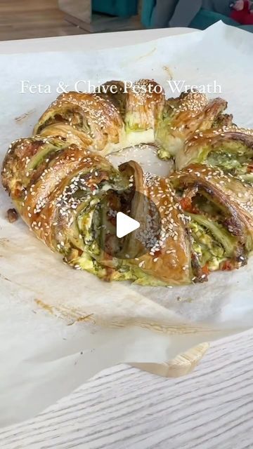 Foodsteer on Instagram: "Feta and Chive Pesto Wreath 👌

Ingredients:

1 x sheet puff pastry 
1/4 x cup pesto (I used Chive) 
200g / 7oz feta crumbled 
2 x tomatoes & 1 garlic clove chopped and drained 
1 x egg for brushing
Sesame seeds 
Drizzle of honey (optional) 

Preheat oven to 190C / 374F

- start by chopping your tomatoes and garlic and season with salt and pepper, drain the juice after 5 min 

- roll out your puff pastry on a sheet of greaseproof paper and spread your pesto, feta and tomatoes and roll vertically

- make diagonal cuts in the roll ONLY about 2/3 down then squish down the parts in the middle with a stick type object as shown in the reel. I used a straw but chopstick would work. Shape into a circle and pinch the two ends to join them together.

- brush with egg wash ad Pesto Wreath, Pastries Savory, Chive Pesto, Phyllo Dough Recipes, Garlic Clove, Xmas Food, Pesto Recipe, Finger Food Appetizers, Healthy Kitchen