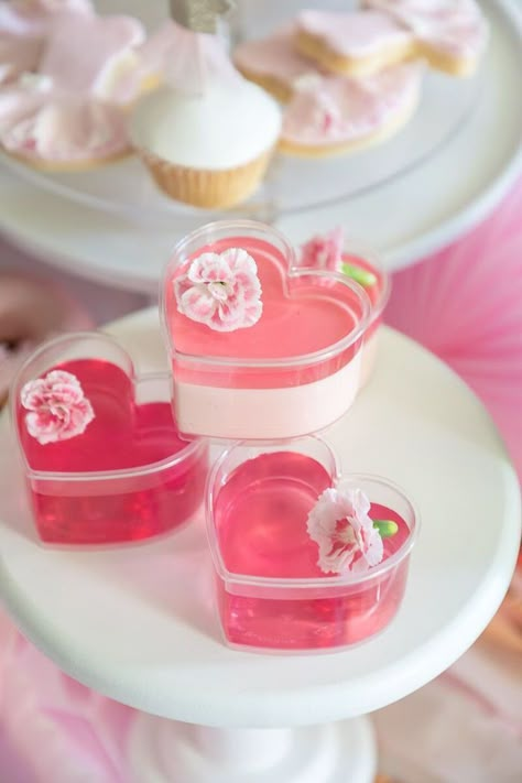 Pink Heart Jello Cups from a Pink + White Ballerina Birthday Party on Kara's Party Ideas | KarasPartyIdeas.com Pretty In Pink Dessert Table, Princess Desserts Ideas, Pink Heart Birthday Party, Pink Snacks For Party Dessert Tables, Pink Jello Cups, Cute Pink Deserts, Pink Barbie Desserts, Pink And White Party Food, Pink And White Party Aesthetic