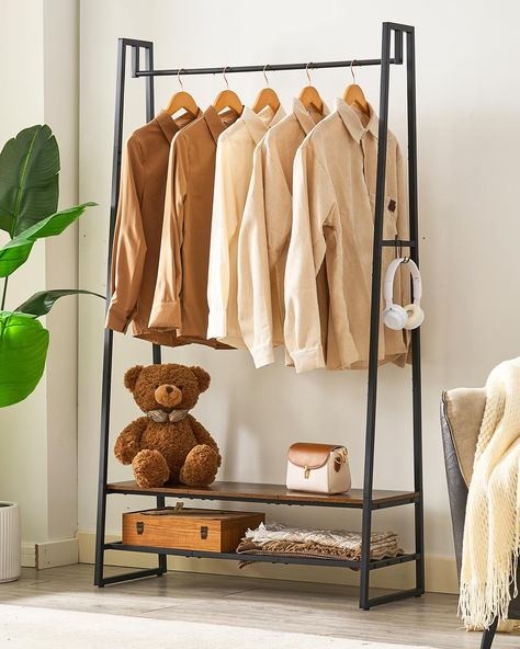 PRICES MAY VARY. Open Clothing Storage Space: Measuring 15 "D x 35 "W x 63 "H, this garment rack's open storage space not only keeps clothes within reach, but also displays them beautifully. 35" long rails allow you to hang more clothes without taking up more space. Multi-functional Standing Clothes Rack: The clothes rack with a hanging rail, 2 shelves and 4 right-angled hooks that won't fall off easily. This clothes hanger rack can easily organize clothes, shoes, bags and accessories to keep yo Cloth Stand Bedroom, Fashion Rack Aesthetic, Cool Clothing Rack, Clothes Hanger Ideas, Clothing Hanger Rack, Cloth Hanger Stand, Clothing Display Rack, Dress Holder, Andys Room