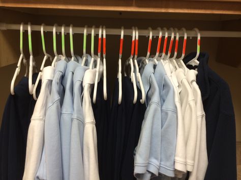 Organize multiple size school uniforms by color. Each child is assigned a color. Color the tags of the pants the same as the hangers. Easy to quickly organize and the kids no longer yell for Mom to figure out who's is who's! School Uniform Organization, Uniform Organization, Kids Hangers, The Hanger, School Uniforms, School Organization, Organization Ideas, Primary School, The Kids