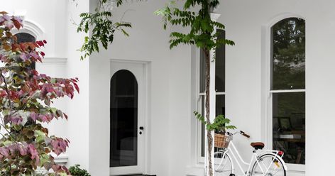 A Renovated Historically Significant Home In Melbourne Steel Frame Doors, Terrace Building, Limestone Pavers, Melbourne Home, Iron Console, House Cladding, Melbourne House, Bedroom Windows, Buy Rugs