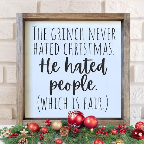 Design: The Grinch Never Hated Christmas. He Hated People (Which is Fair) This 13.5" x 13.5" hand-painted sign comes with a shadowbox-style frame and can stand alone on a shelf. It also comes ready to hang on a wall with a sawtooth hanger. All wood signs ship via USPS with free shipping. Please make sure your address is correct. NOTE: Each wood sign is hand-painted. No vinyl is used. Each sign is unique, takes 3-5 business days to create, and will vary slightly in appearance depending on wood gr Grinch Christmas Wood Signs, The Grinch Signs, Farmhouse Christmas Signs Diy, Cricut Christmas Signs Wood, Holiday Sayings For Signs, Xmas Signs On Wood, Grinch Wood Crafts, Diy Wood Christmas Decor, Grinch Signs Wooden Diy