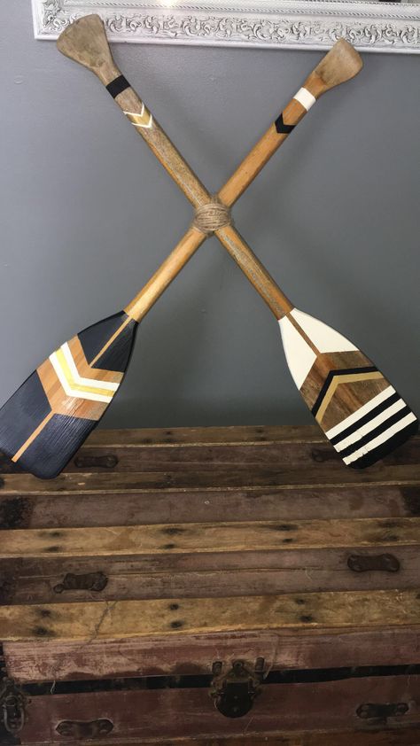 Oar decor. #paint #diy Painted Canoe Paddles Diy, Painted Oar Designs, Old Oars On Wall Decor Ideas, Wood Paddle Decor Ideas, Oar Painting Ideas, Painted Oars Paddles Diy, Painted Oars Paddles Wall Art, Oar Decorating Ideas, Painted Canoe Paddles