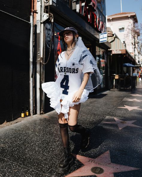 DARIA Y MARIA “Warriors” dress❤️ Worldwide delivery 📦 www.dariaymaria.shop Our dresses are unique, they combine the essence of sports culture with luxurious elements, such as silk ruffles and rhinestone accents, making them a true work of art. Photographer: @donatello.ph Model: @thekatherinemadrid Creative director and stylist @maria_viasilvia . . #upcycledfashion #upcycling #celebritystylist #lafashion #losangelesfashion #footballjersey Creative Director Fashion Style, Warrior Dress, Magic Hour, Strategic Marketing, Los Angeles Style, Upcycled Fashion, La Fashion, Sporty Chic, College Fashion