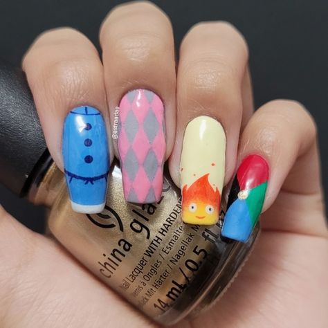 a heart is a heavy burden Howls Moving Castle Inspired Nails, Calcifer Nail Art, Howls Moving Castle Nail Design, Howls Moving Castle Nail Art, Calcifer Nails, Howls Moving Castle Nails, Castle Nails, Anime Inspired Nails, Geeky Nails