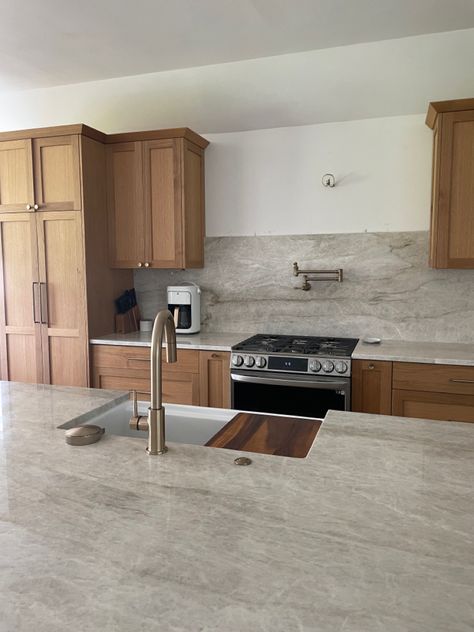 White Brown Countertops, Wood Cabinets With Grey Countertops, Quartz Countertops With Light Wood Cabinets, Uneven Kitchen Cabinets, Kitchen With Taj Mahal Countertops, Taj Mahal Quartzite Countertops Walnut Cabinets, Tan Mahal Countertop, Leather Quartzite Countertops, Yak Mahal Quartzite